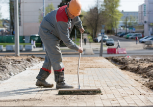 A professional cleaning a paver
